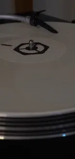 Minimalist beige vinyl record on turntable.