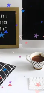 Minimalist workspace with coffee and inspirational message on desk.