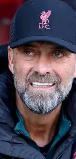 Portrait of a focused football coach in a stadium setting.