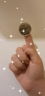 Coin balanced on a finger against a beige background wallpaper.