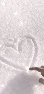 Heart drawn in snow with a hand reaching out, minimalistic and serene.