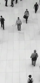 Black and white urban walkway with people walking.