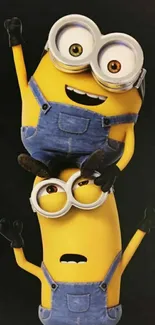 Two cheerful Minions on a dark background.