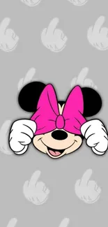 Playful Minnie Mouse with pink bow on gray background.