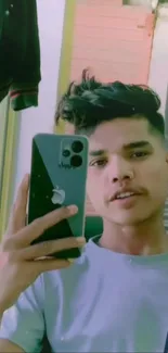 Mirror selfie with an iPhone showcasing style.