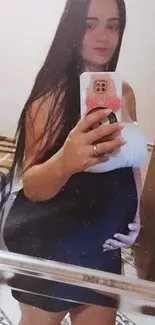 Mirror selfie with smartphone and stylish look.