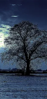 Serene moonlit landscape with a solitary tree, perfect for mobile wallpaper.