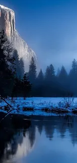 Misty mountain and river in blue tones.