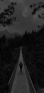 Person walking on a suspension bridge in a misty forest setting.