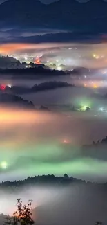 Misty mountain landscape with glowing lights at night.