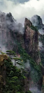 Misty mountains with lush green peaks and rugged rocks.