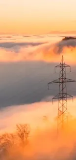 Misty mountain sunset with power line silhouette.