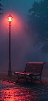 Misty night park with glowing lamp and bench.