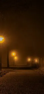 Misty night street with glowing lights in the fog.