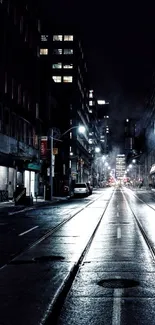 Misty urban night street with tall buildings.