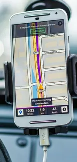 Mobile phone with GPS navigation in car holder.