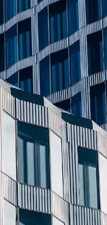 Modern geometric building facade with blue and white patterns.