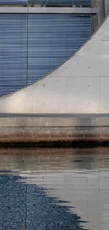 Concrete structure reflected in water.