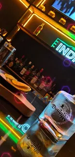 Modern bar with neon lights and tequila on the table.