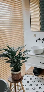 Modern bathroom with plant, vanity, and wood accents.