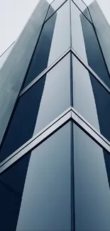 Sleek modern glass building facade, abstract architecture view.