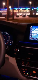 Car dashboard glowing at night, showcasing modern interior.