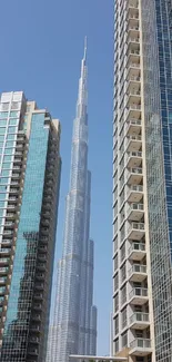 Modern skyline with towering skyscrapers under a clear blue sky.