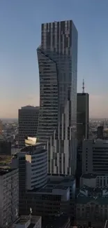 Modern skyscraper under a blue sky in cityscape view.