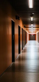 Dimly lit modern corridor with orange walls.