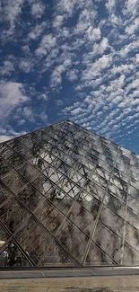 Glass pyramid against a beautiful sky background.