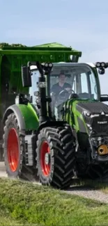 High-quality wallpaper featuring a modern green tractor on a rural path.