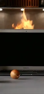 Laptop with fire backdrop in a kitchen scene.