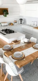 Minimalist kitchen with a wooden dining table and sleek white cabinets.