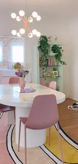 Cozy dining room wallpaper with pink chairs and modern decor.