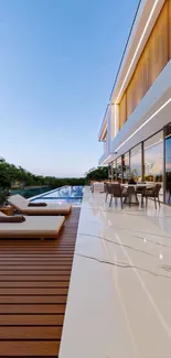 Modern luxury villa with poolside view and elegant outdoor seating.