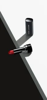 Red lipstick on a sleek black and white design background.