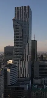 Modern skyscraper towering in urban cityscape with blue sky.