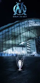 Night view of stadium with trophy and glowing blue details.