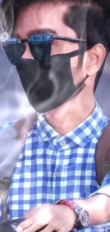 Man with sunglasses and black mask in blue checkered shirt