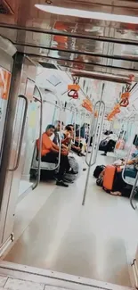 Interior shot of a modern subway with commuters seated inside.