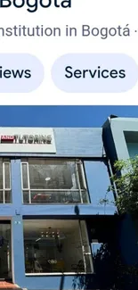 Modern urban building facade with blue exterior.