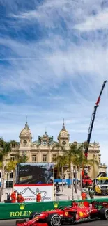 Monaco F1 car racing by skyline with historic buildings and vibrant sky.