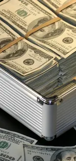 Open briefcase with stacks of cash, scattered dollar bills around.