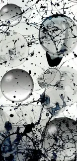 Monochrome abstract art with bold splatters and circular patterns.