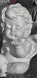 Serene monochrome angel statue sending a kiss.