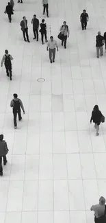 Monochrome urban walkway with people walking.