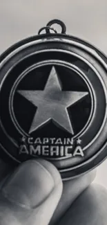 Monochrome Captain emblem with star design on a gray background.