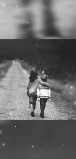 Black and white image of two kids walking on a path, evoking nostalgia and friendship.