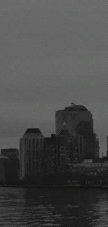 Monochrome cityscape wallpaper featuring urban skyline in gray tones.