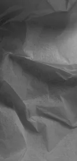 Grayscale crumpled paper texture wallpaper for mobile devices.